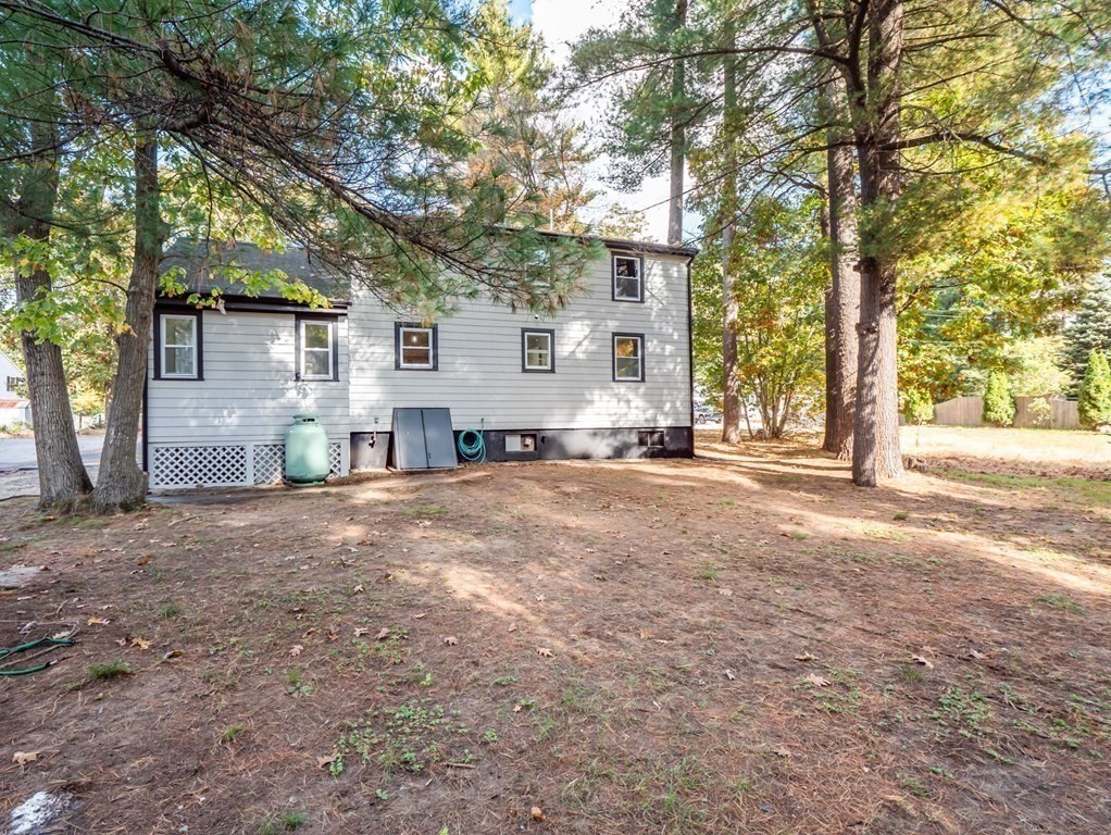 116 Arkansas Road Tewksbury, MA 01876 - Photo 32 of 38 a view of a house with a street