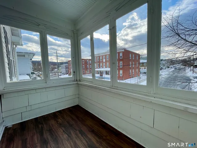 a view of entryway with wooden floor
