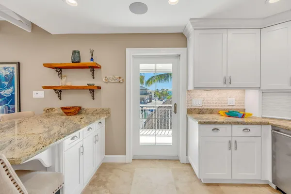 an aerial view of residential building and lake