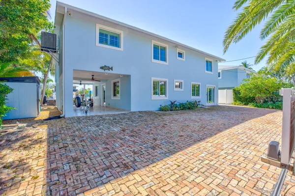 a bathroom with a tub shower and sink