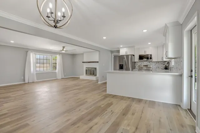 a view of kitchen cabinet and microwave