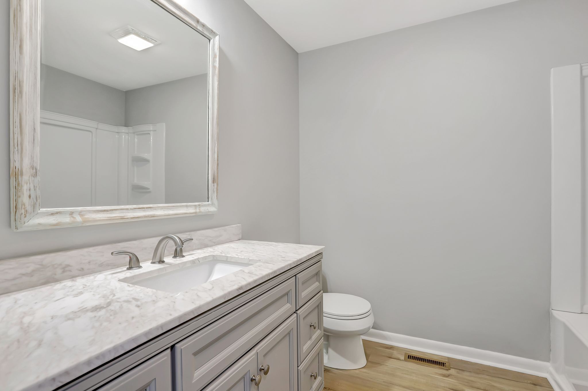 1481 Maxwell Road Belvidere, TN 37306 - Photo 30 of 45 a bathroom with a granite countertop sink a toilet and a mirror