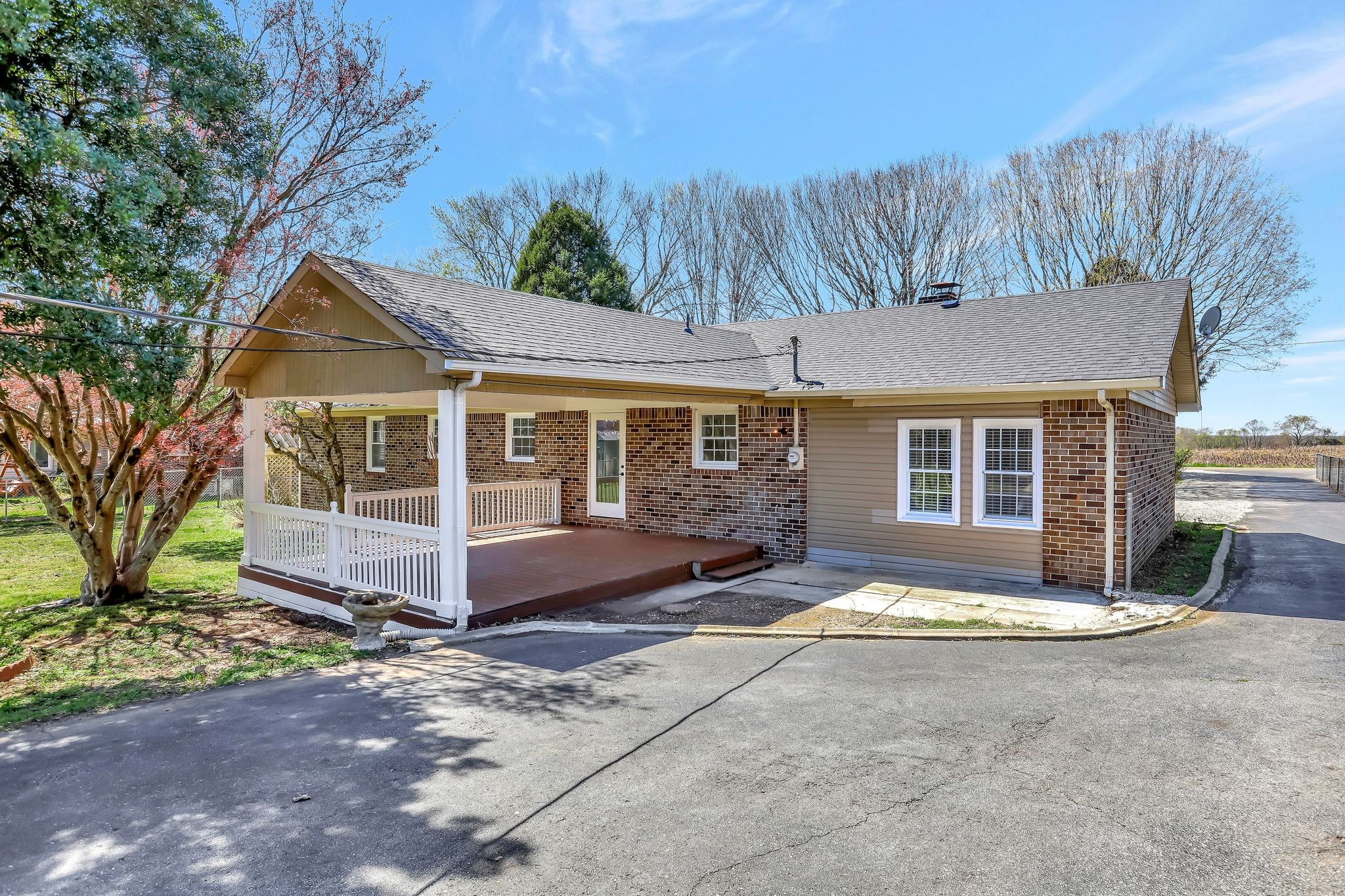 1481 Maxwell Road Belvidere, TN 37306 - Photo 36 of 45 a front view of a house with a garden and yard