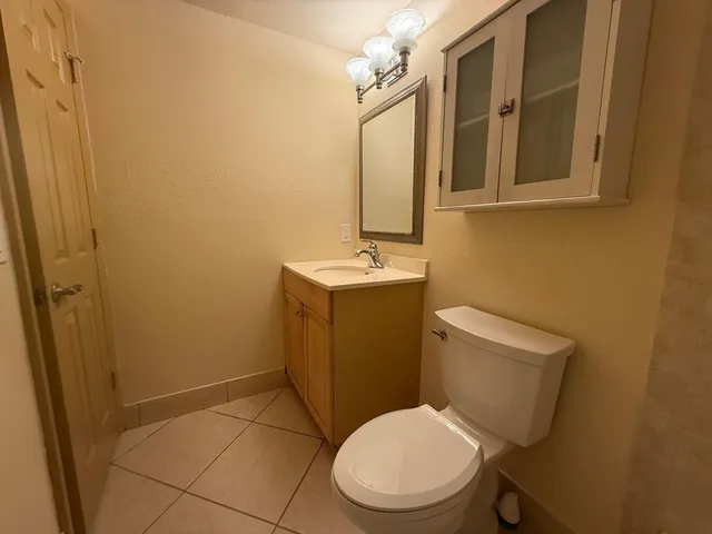 a bathroom with a toilet and a bath tub