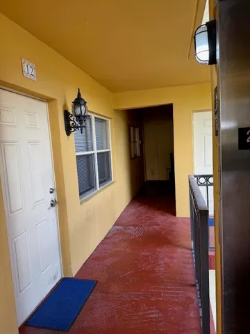 a view of balcony with two windows
