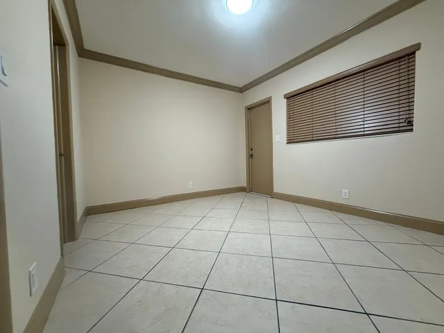 a view of an empty room and window