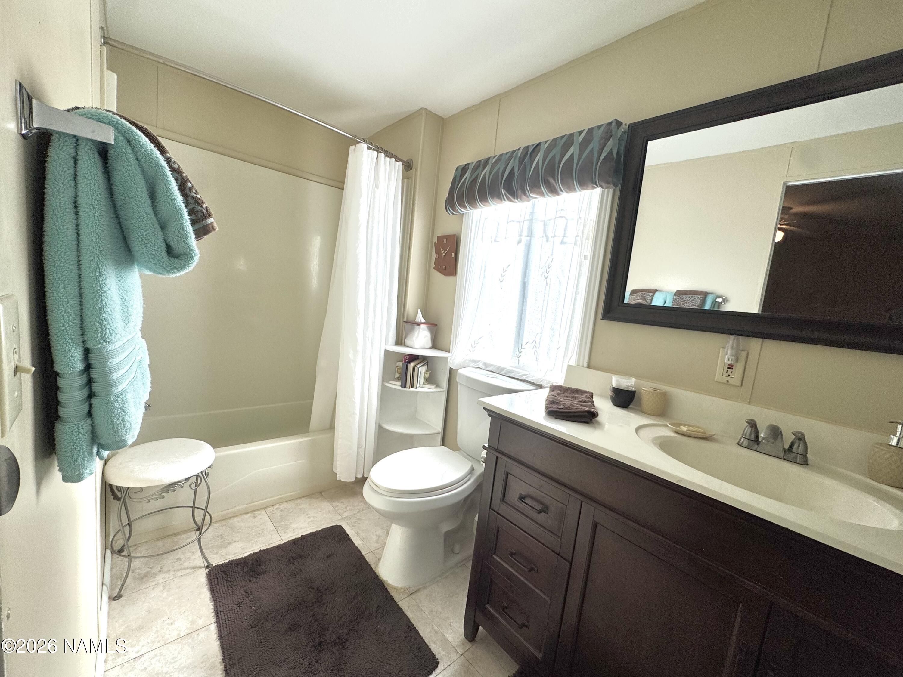 45 Fairlane Road Munds Park, AZ 86017 - Photo 15 of 24 a bathroom with a sink toilet and shower
