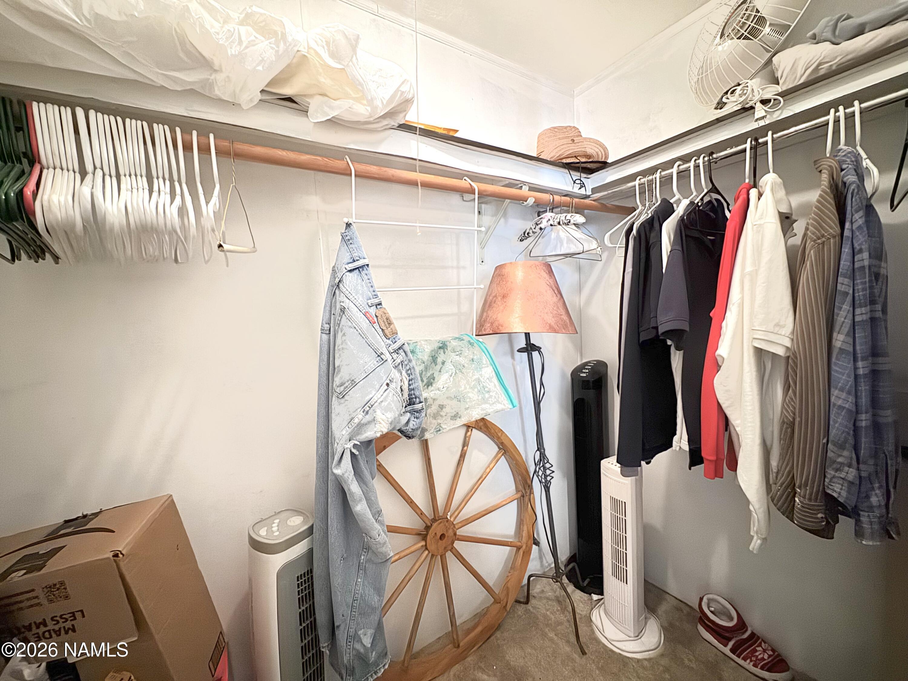 45 Fairlane Road Munds Park, AZ 86017 - Photo 17 of 24 a view of walk in closet with clothes and shoes