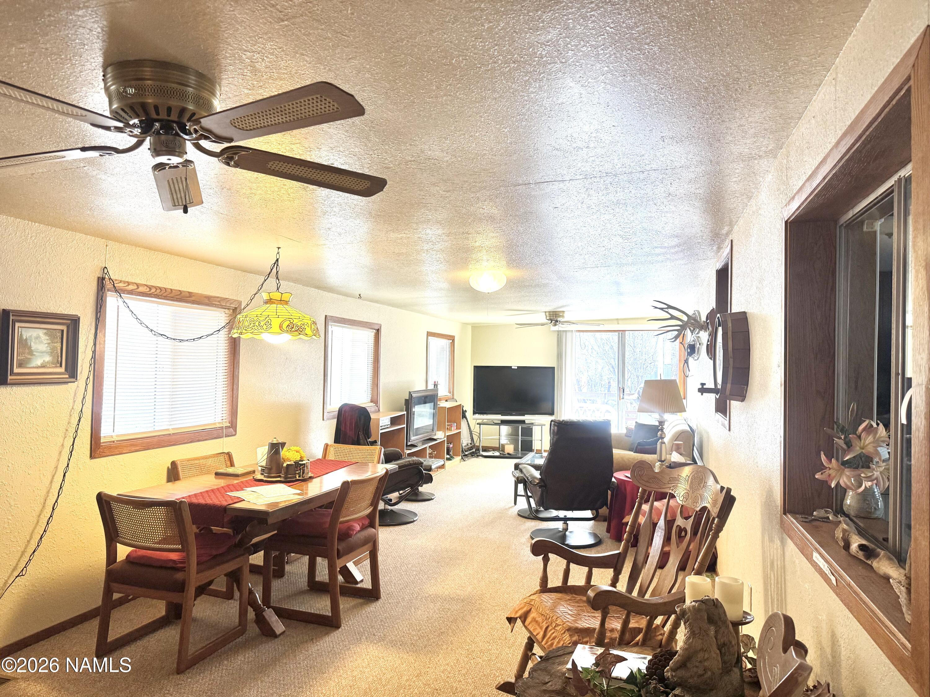 45 Fairlane Road Munds Park, AZ 86017 - Photo 5 of 24 a view of a dining room with furniture window and outside view