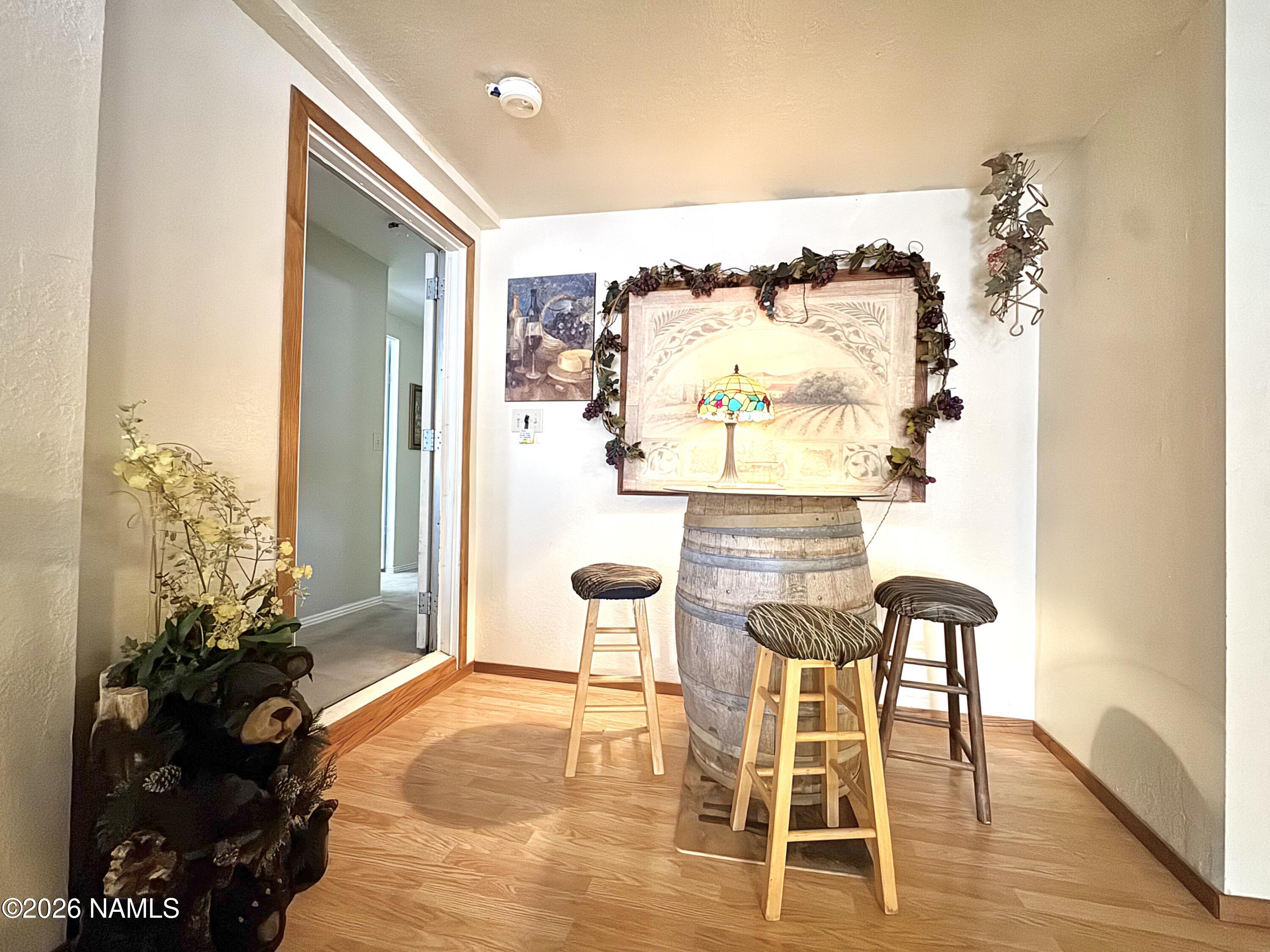45 Fairlane Road Munds Park, AZ 86017 - Photo 7 of 24 a living room with furniture and a floor to ceiling window