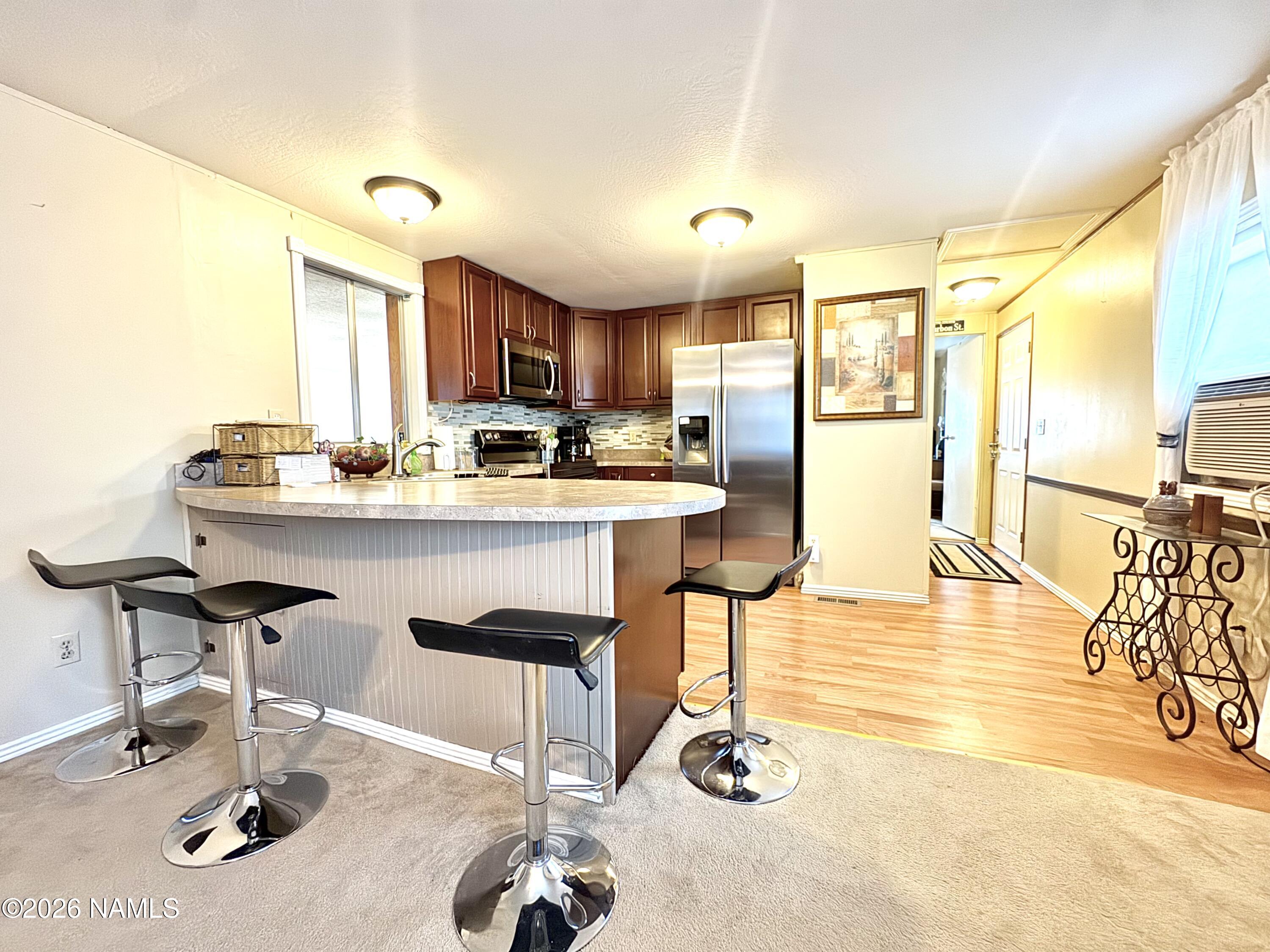 45 Fairlane Road Munds Park, AZ 86017 - Photo 9 of 24 a kitchen with a sink appliances and a counter top space