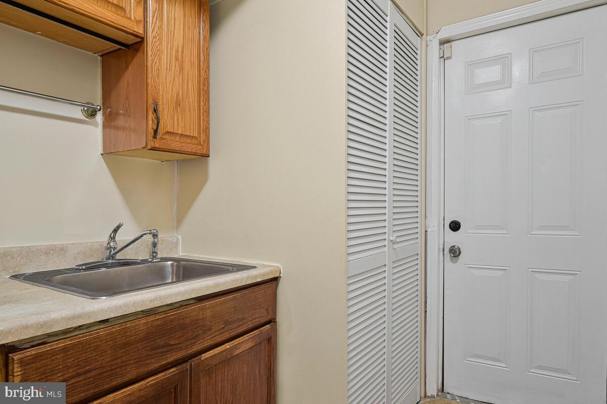 3427 B Street Southeast, Unit 2 Washington, DC 20019 - Photo 11 of 14 a bathroom with a sink and a mirror