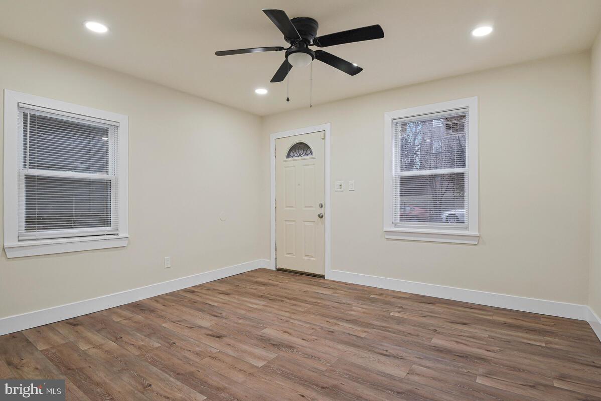 3427 B Street Southeast, Unit 2 Washington, DC 20019 - Photo 6 of 14 a view of empty room with wooden floor and fan