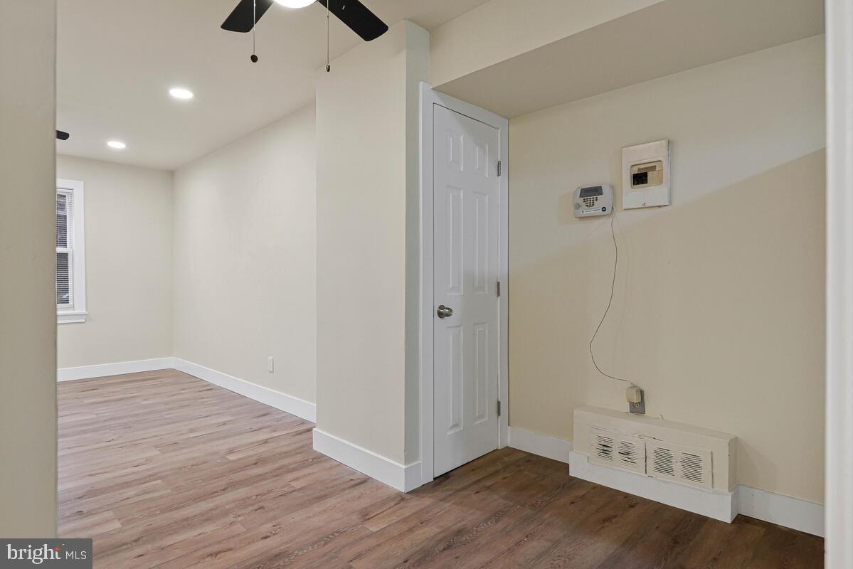3427 B Street Southeast, Unit 2 Washington, DC 20019 - Photo 7 of 14 wooden floor in an empty room with a window