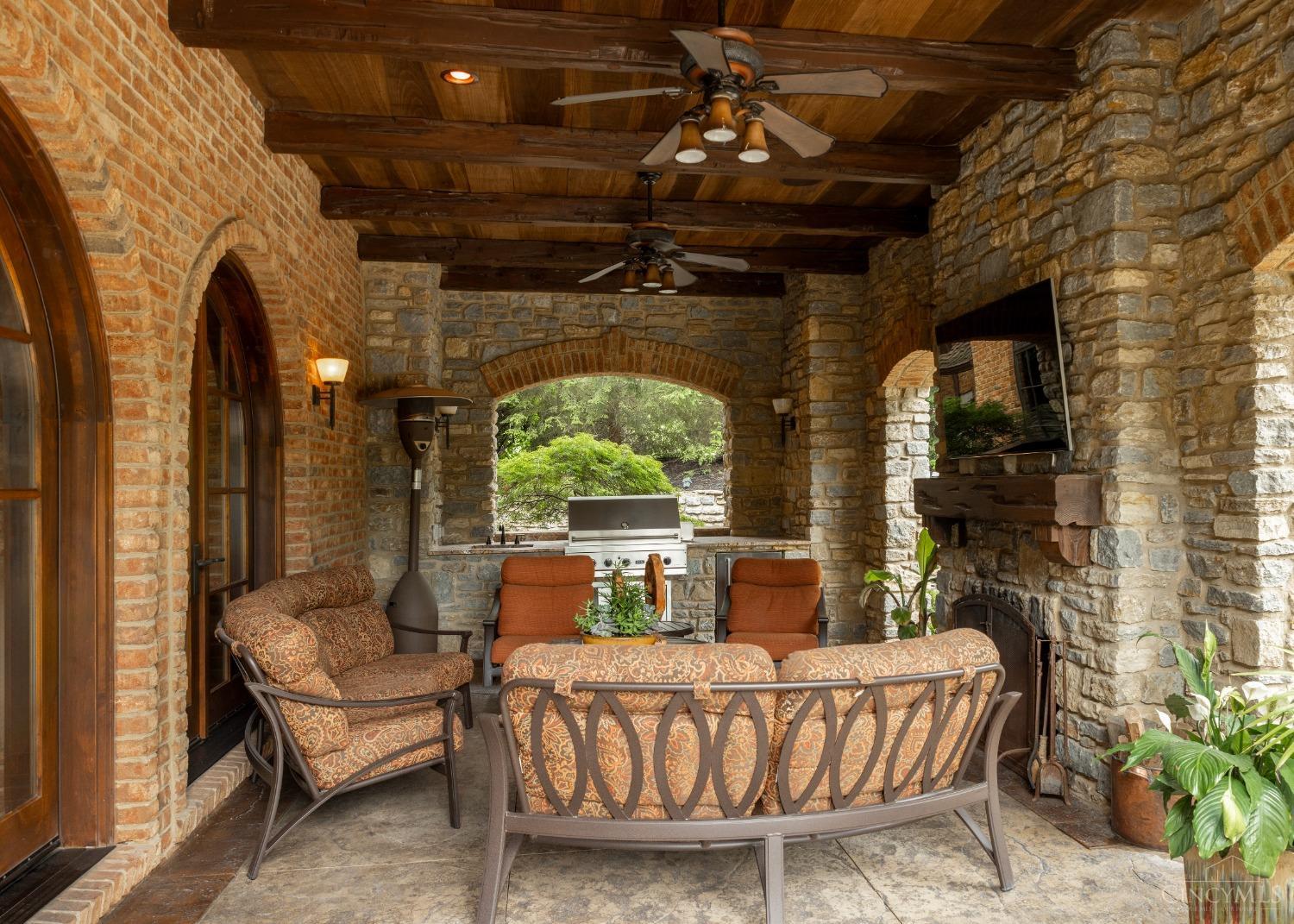 5900 Park Road Cincinnati, OH 45243 - Photo 34 of 50 Outdoor entertainment area (24’ X 14’) How nice is it to entertain when you have direct access to the inside kitchen/breakfast area and the outside pool and spa areas? Did I mention the outdoor grill, wood-burning fireplace, and TV?
