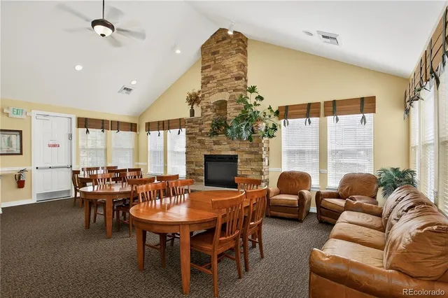 a dining room with furniture a chandelier and window