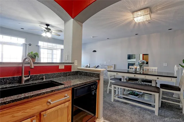 a kitchen with a stove a sink and a microwave