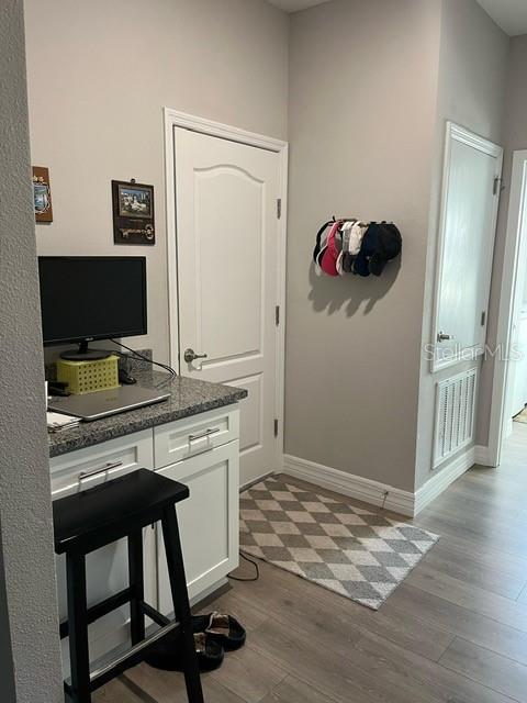 15610 Southwest 40th Terrace Ocala, FL 34473 - Photo 11 of 14 a workspace with furniture and wooden floor