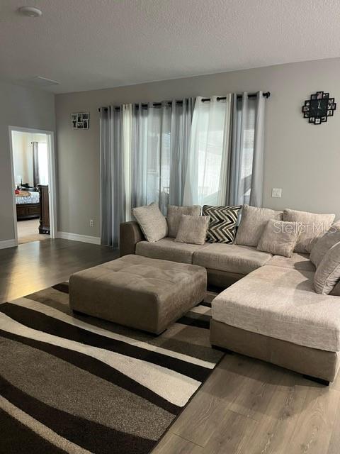 15610 Southwest 40th Terrace Ocala, FL 34473 - Photo 5 of 14 a living room with furniture and a window