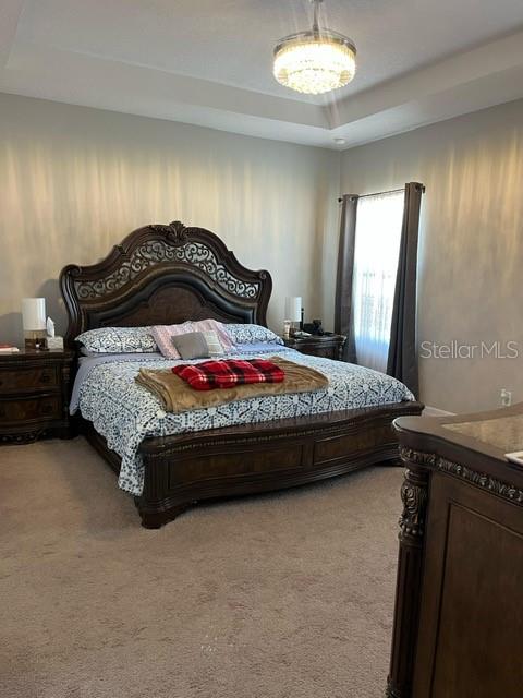 15610 Southwest 40th Terrace Ocala, FL 34473 - Photo 6 of 14 a bedroom with a bed and a dresser