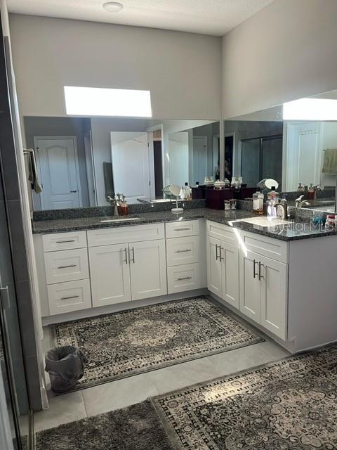 15610 Southwest 40th Terrace Ocala, FL 34473 - Photo 7 of 14 a kitchen with a sink a cabinets and window