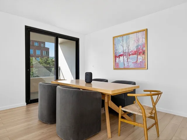 a view of a dining room with furniture and window