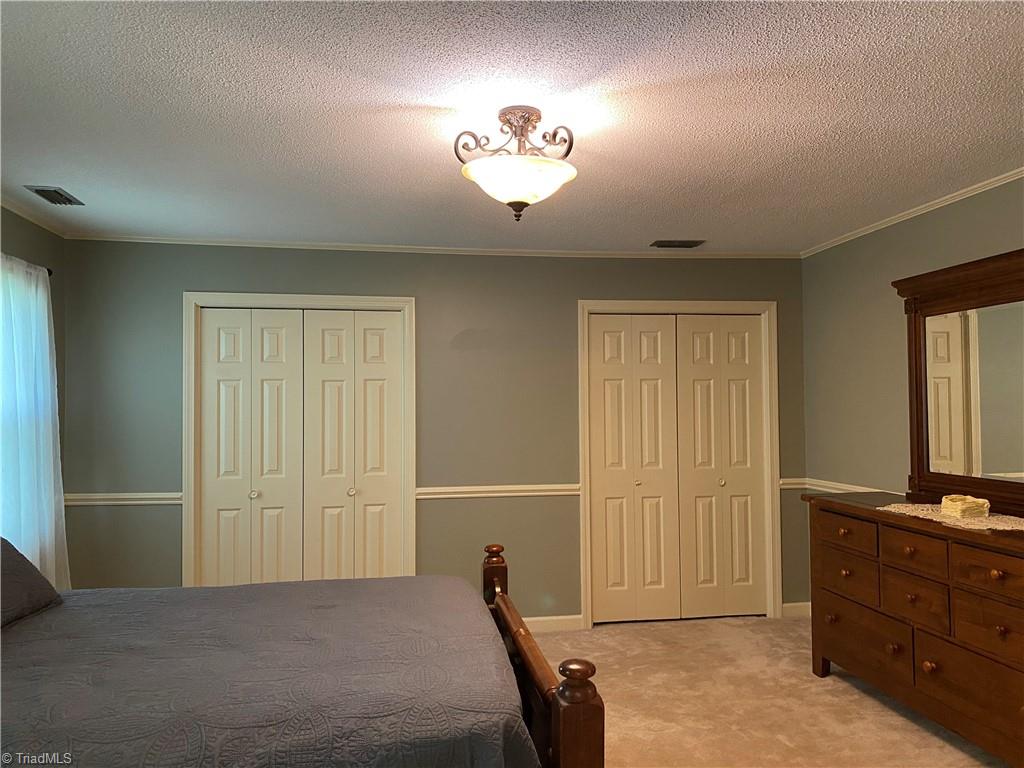 239 Pine Valley Road Mocksville, NC 27028 - Photo 17 of 29 3rd bedroom second floor. Attic access through this room by door. partially floored