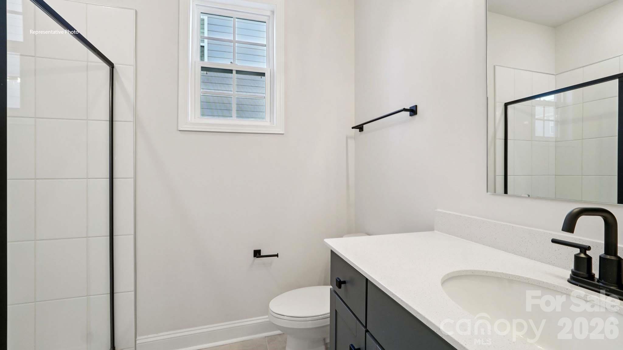 7609 Bainbridge Road Sherrills Ford, NC 28673 - Photo 17 of 36 a bathroom with a sink toilet vanity and shower