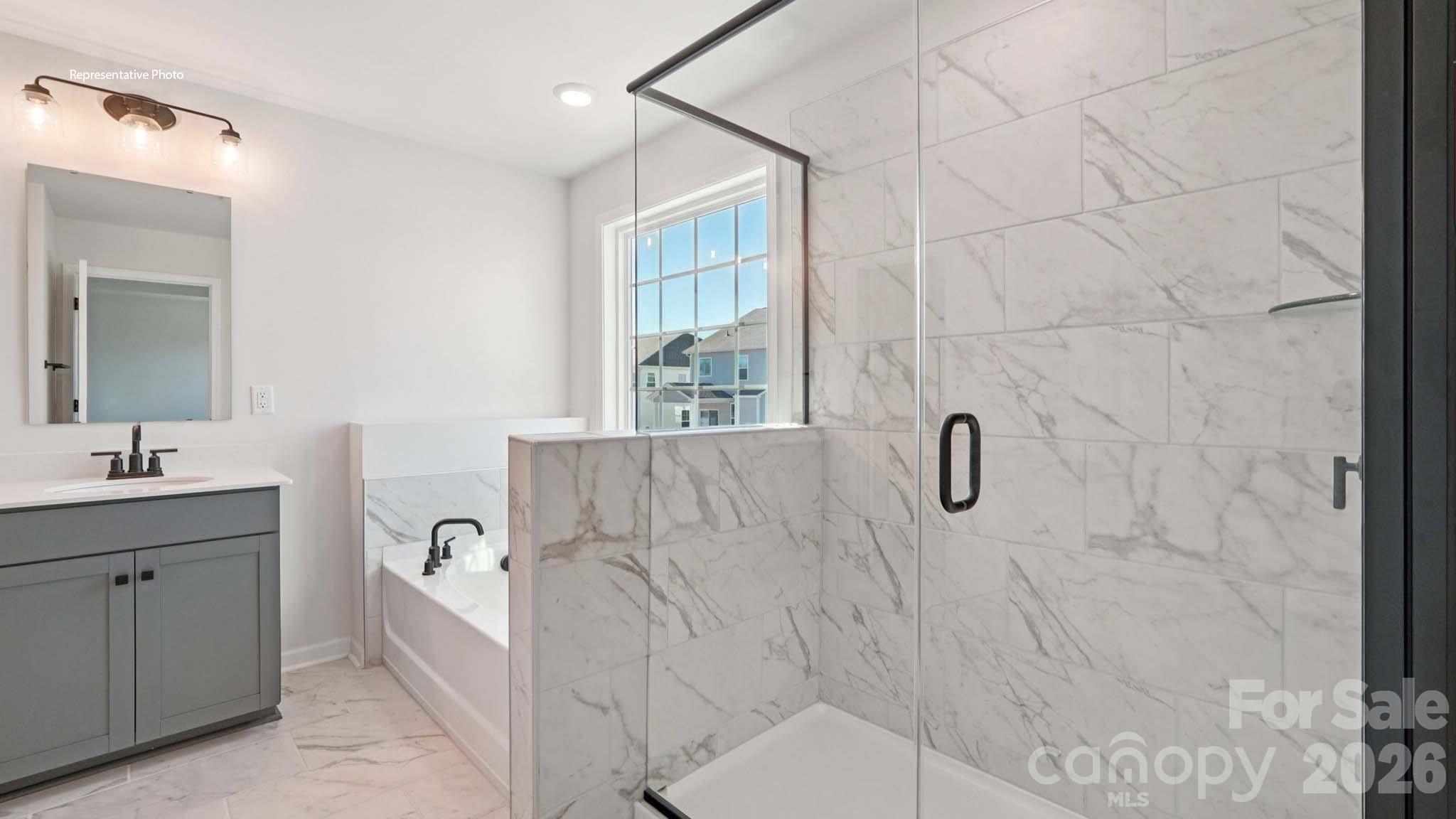 7609 Bainbridge Road Sherrills Ford, NC 28673 - Photo 28 of 36 a bathroom with a bathtub sink a mirror and vanity