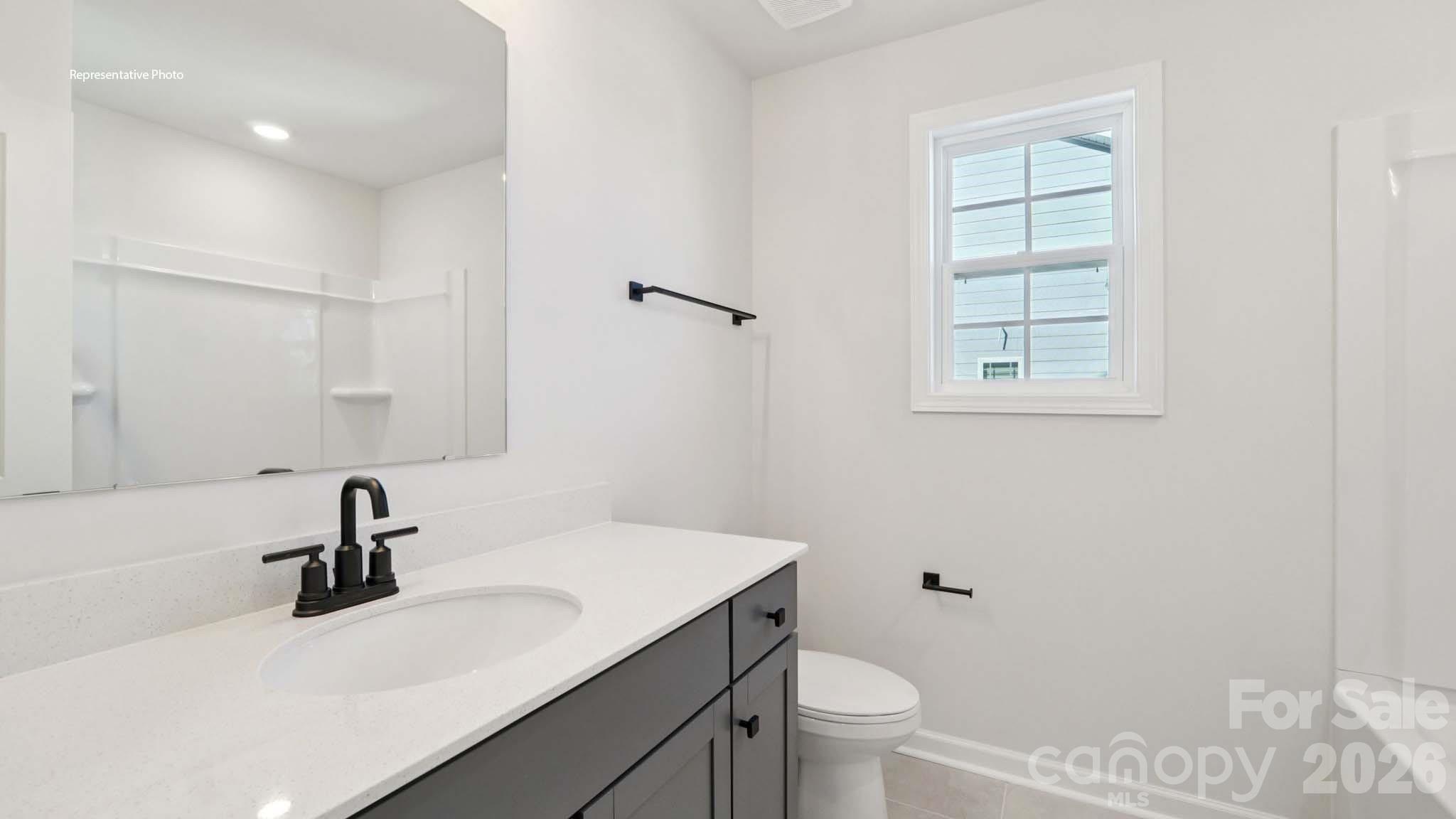 7609 Bainbridge Road Sherrills Ford, NC 28673 - Photo 32 of 36 a bathroom with a sink toilet a vanity and