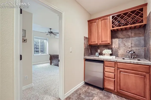 a kitchen with granite countertop a sink and cabinets