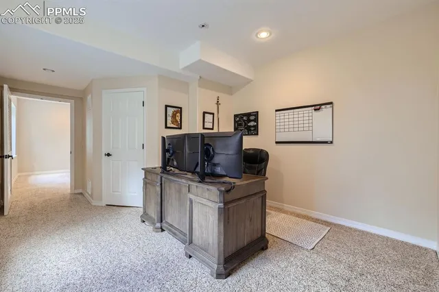 a view of kitchen with cabinets microwave and stove