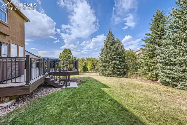 a view of a bench in a backyard