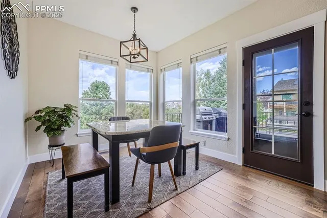 a view of a dining room with furniture window and wooden floor