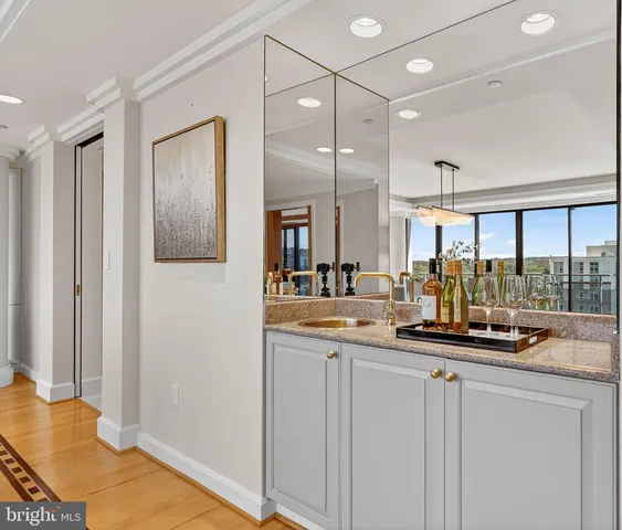 a kitchen with stainless steel appliances a sink and a refrigerator