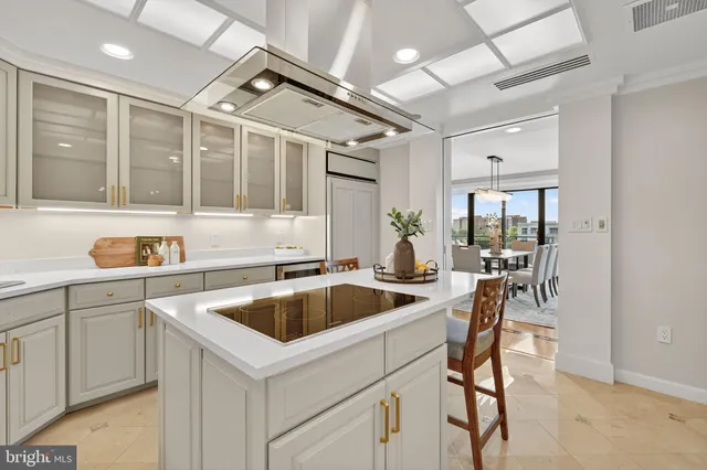 a kitchen that has a sink and cabinets