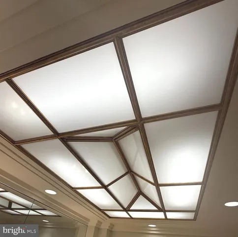 a view of a bathroom with a sink and a mirror
