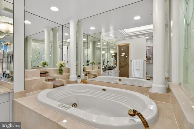 a spacious bathroom with sinks mirror and a shower