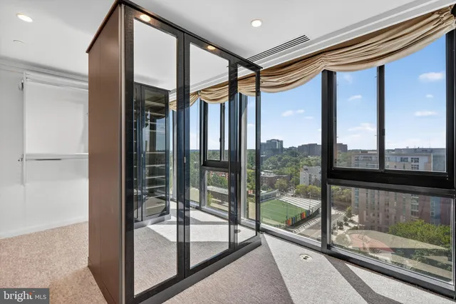 a very nice looking room with a large window and chandelier