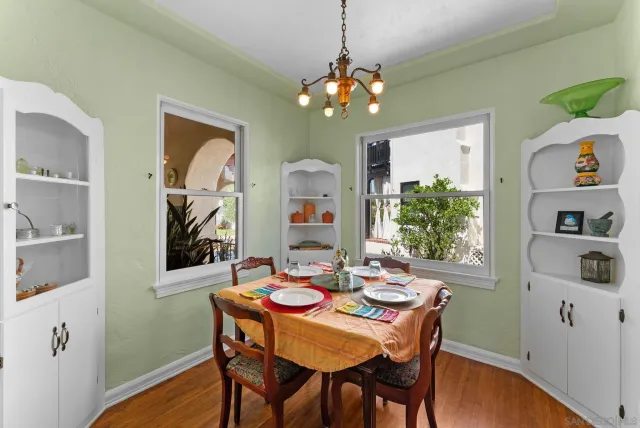 a dining room with furniture and window