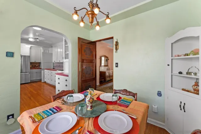 a dining room with furniture and wooden floor