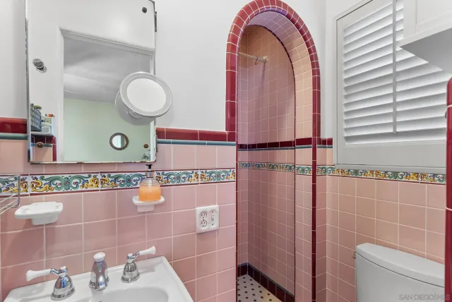 a bathroom with a sink and mirror