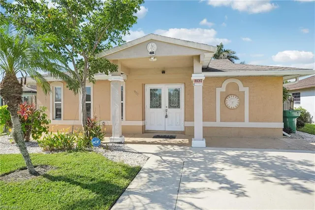 a front view of a house with garden