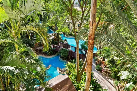 a view of a dining room with furniture wooden floor and chandelier