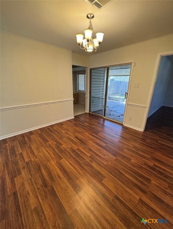 1417 Camilla Road Killeen, TX 76549 - Photo 21 of 22 a view of an empty room with wooden floor and a window