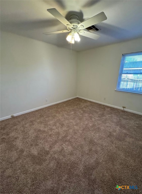 1417 Camilla Road Killeen, TX 76549 - Photo 6 of 22 an empty room with windows and fan