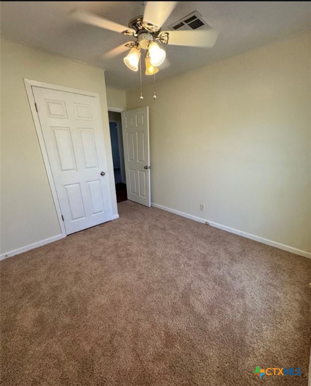 1417 Camilla Road Killeen, TX 76549 - Photo 7 of 22 an empty room with a fan & a ceiling fan