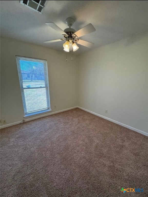 1417 Camilla Road Killeen, TX 76549 - Photo 10 of 22 an empty room with windows and fan
