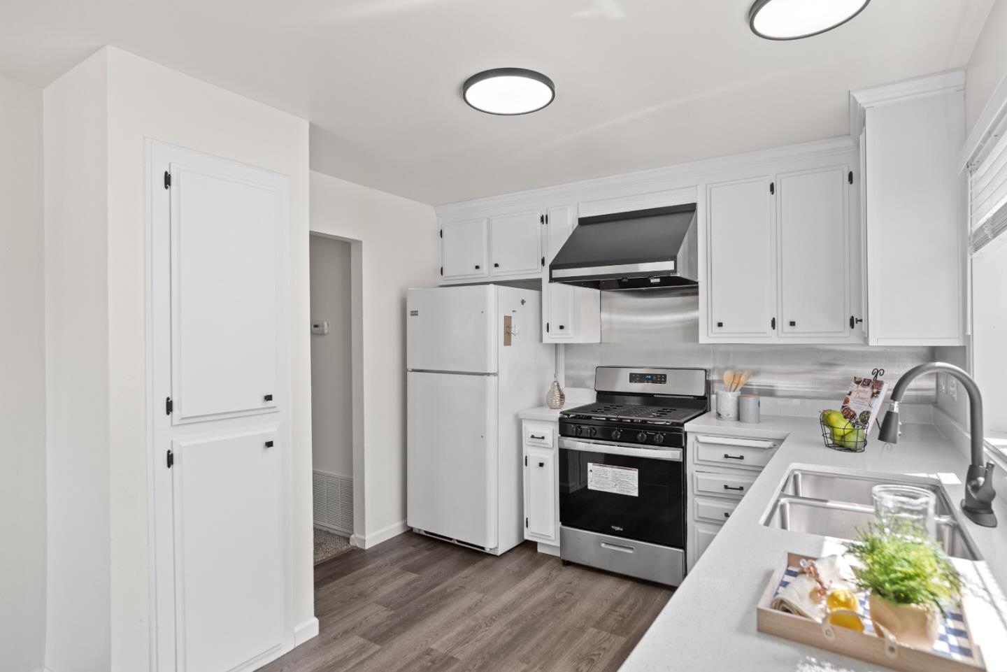 773 Andrea Way Pittsburg, CA 94565 - Photo 11 of 35 a kitchen with stainless steel appliances white cabinets and a stove