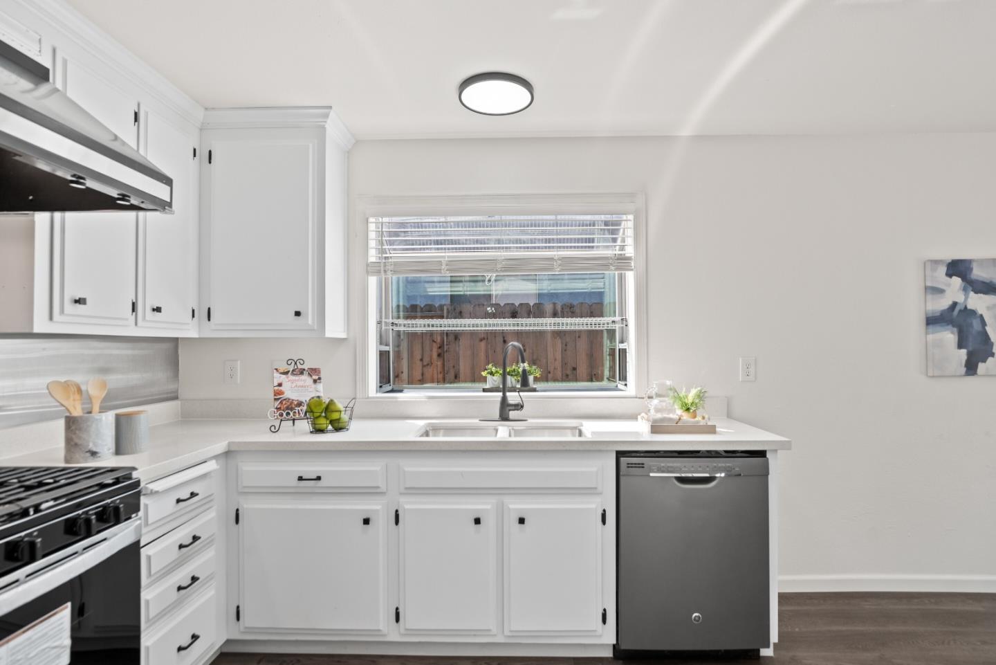 773 Andrea Way Pittsburg, CA 94565 - Photo 13 of 35 a kitchen with granite countertop a sink cabinets window and appliances